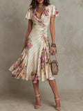 Alba | Elegante abito midi avvolgente con stampa floreale e ruches