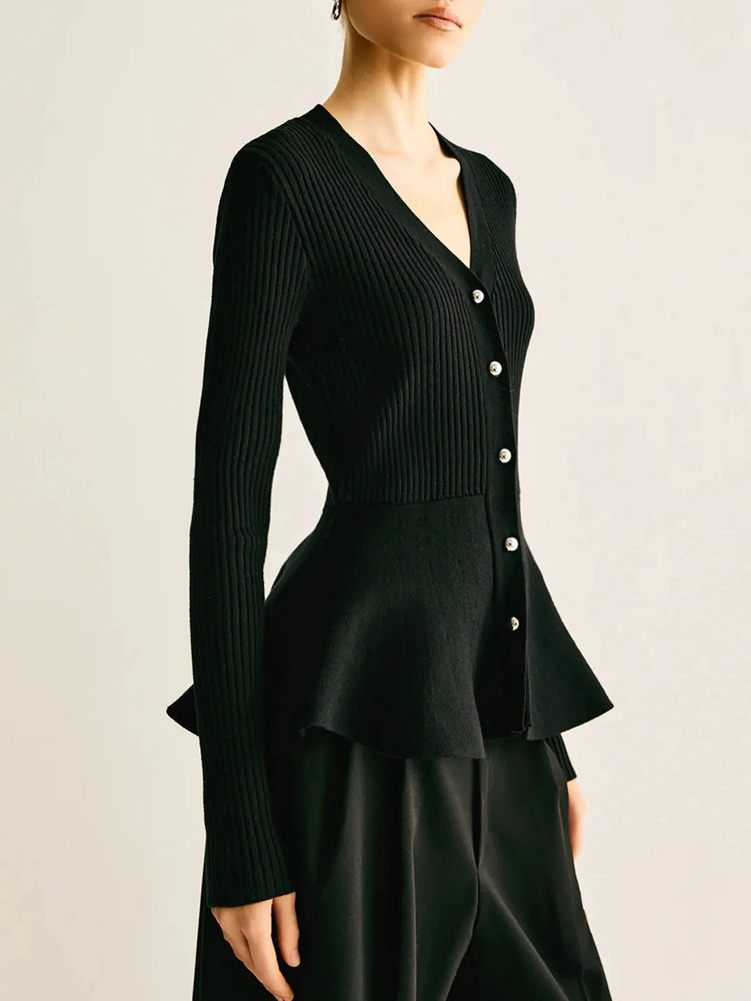 Delia | Top in maglia a costine con peplo