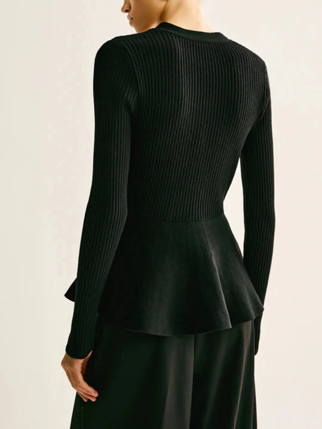 Delia | Top in maglia a costine con peplo