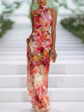 Abito lungo rosso in chiffon floreale con scollo a halterneck senza maniche