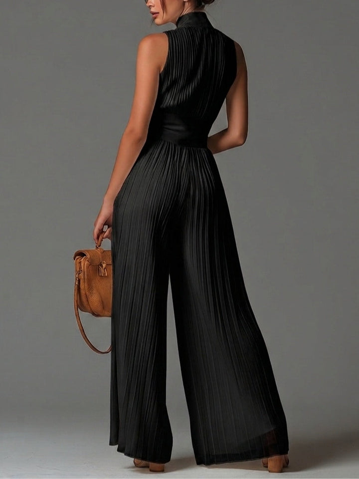 Tuta in chiffon nera con scollo a V, senza maniche, zip frontale, a pieghe, pantaloni palazzo