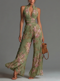 Tuta in chiffon verde con stampa floreale, scollo a V, senza maniche, con zip, plissettata, a palazzo